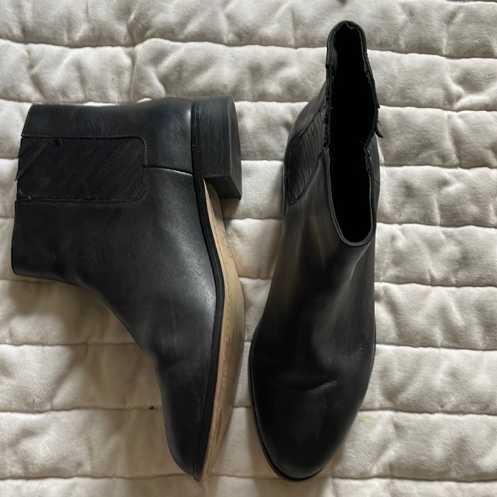 Black leather booties, with striped pattern down ankles